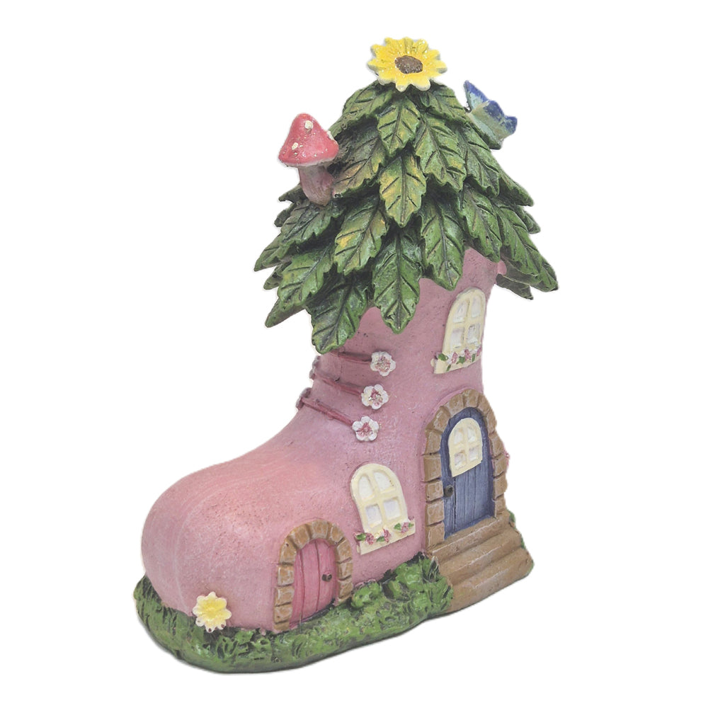 Front view of pink fairy boot house mini with blue door stone steps and flower boxes