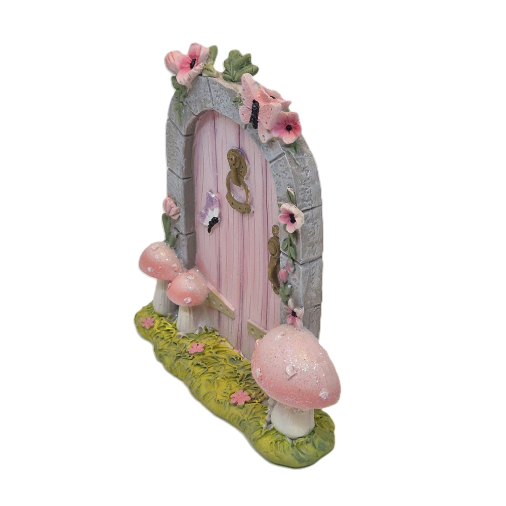 Side view of fairy door with mushrooms showing stone arch depth and toadstool detail