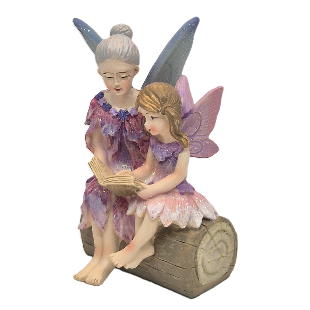Side view of fairy grandmother and granddaughter reading figurine - Flower Garden Collection Earth Fairy