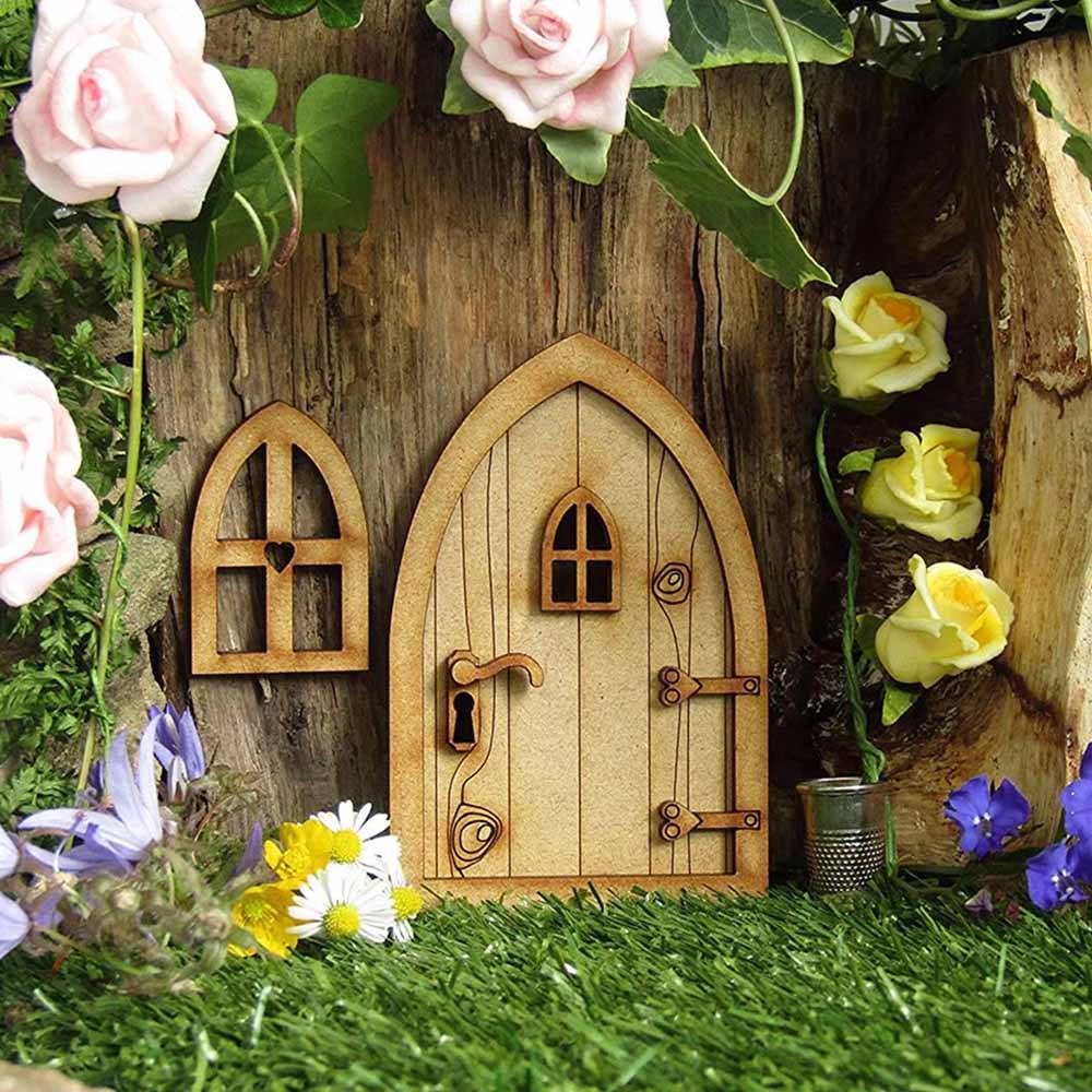 DIY Mini Wooden Fairy Door with Window - showing door in a fairy garden setting