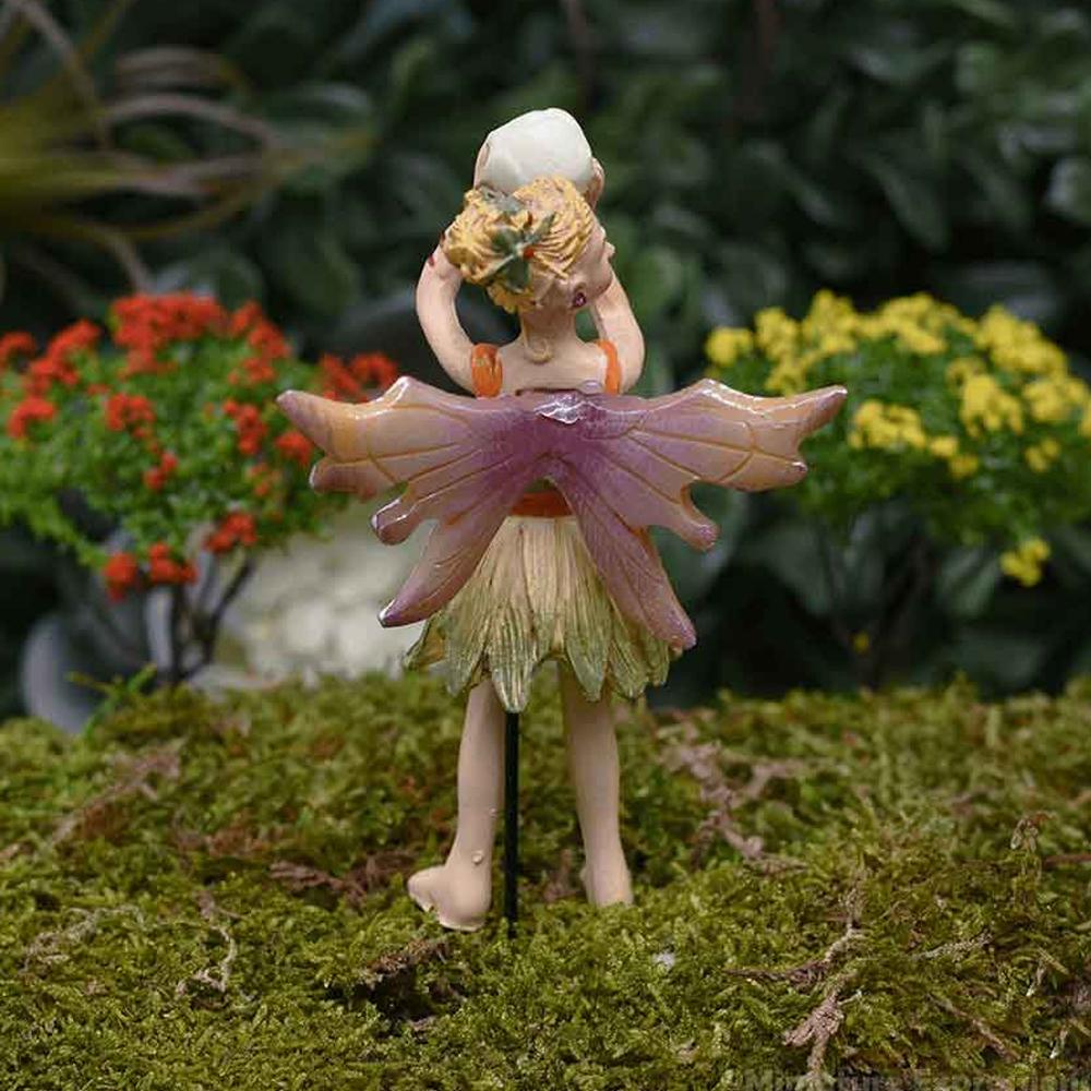 Fairy Anna, Glow in the Dark Figurine, a resin fairy garden figurine of a fairy wearing green clothes and holding a glowing orb