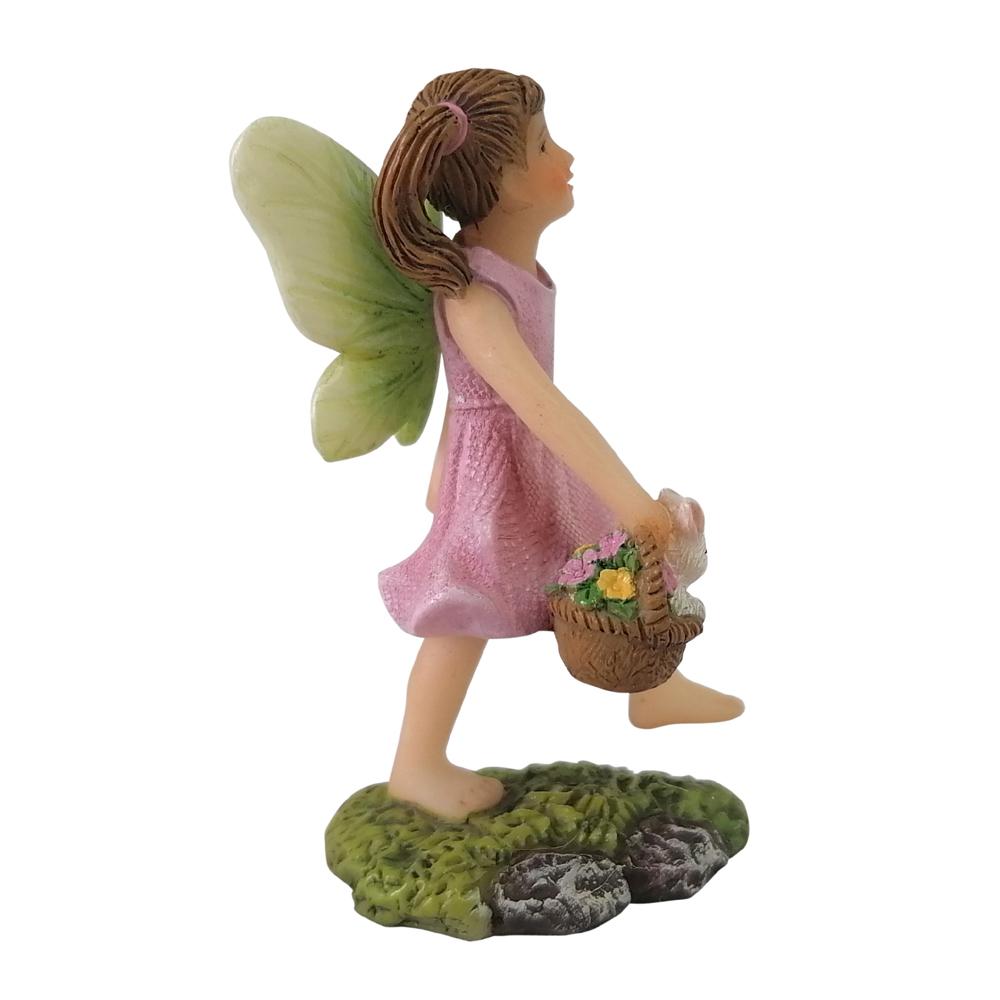 Side view of Fairy Harper with Bunny, a miniature resin fairy garden figurine, shown walking with a bunny in a basket