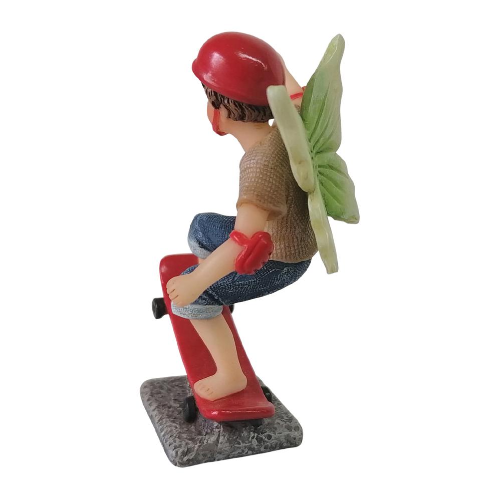 Side view of Fairy Noah Riding a Skateboard, a miniature resin fairy figurine for the garden