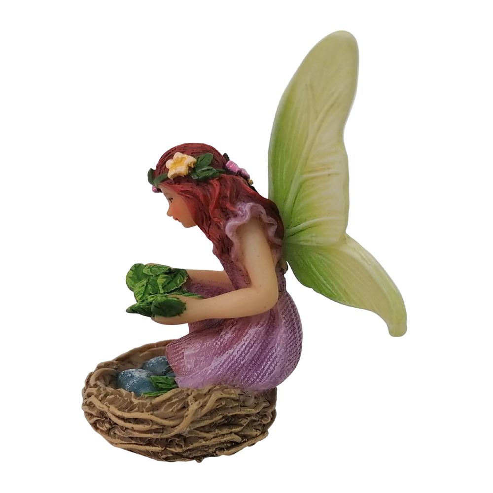 Side view of Fairy Willow with Bird Nest, a miniature resin fairy garden figurine