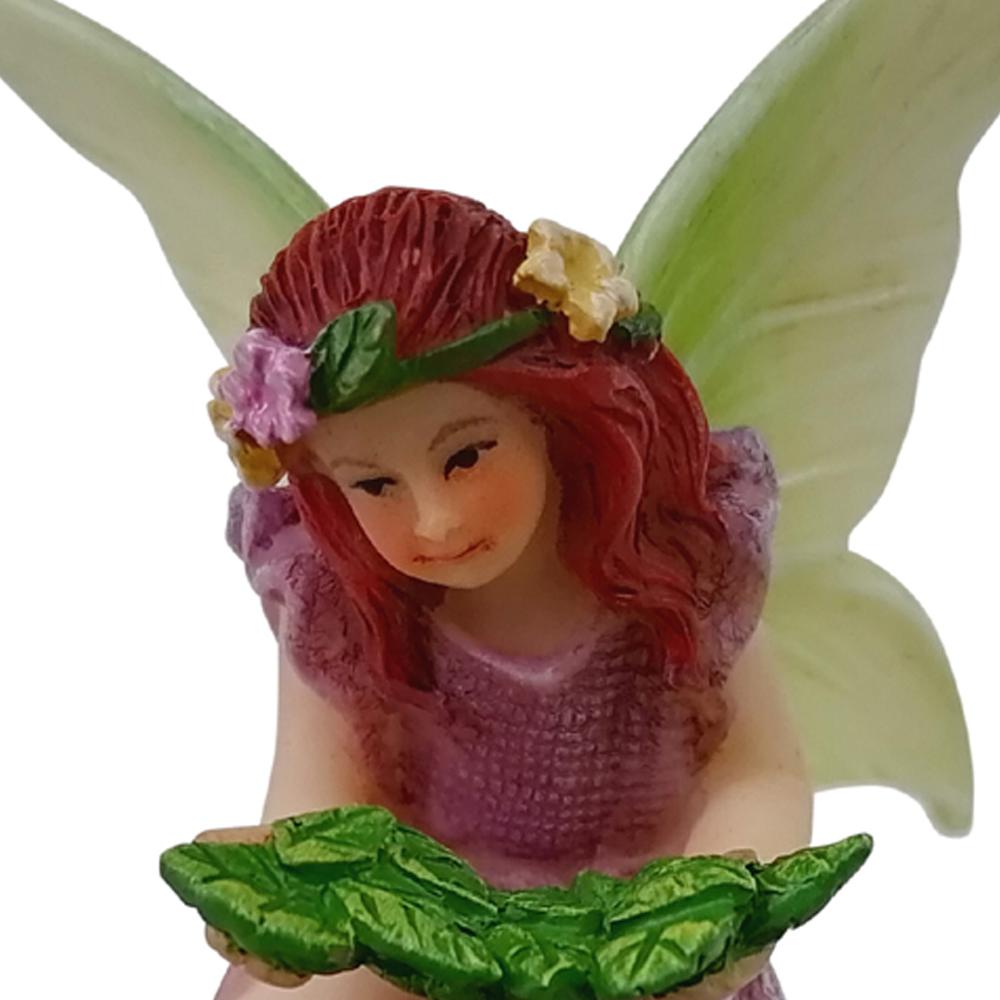 Fairy Willow with Bird Nest - a miniature resin fairy garden figurine depicting a fairy atop a nest with eggs