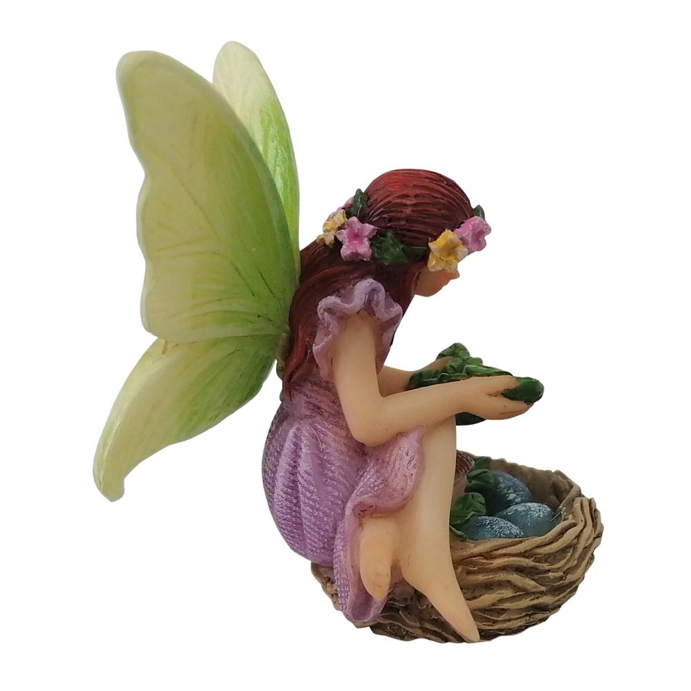 Side view of Fairy Willow with Bird Nest, a miniature resin fairy garden figurine