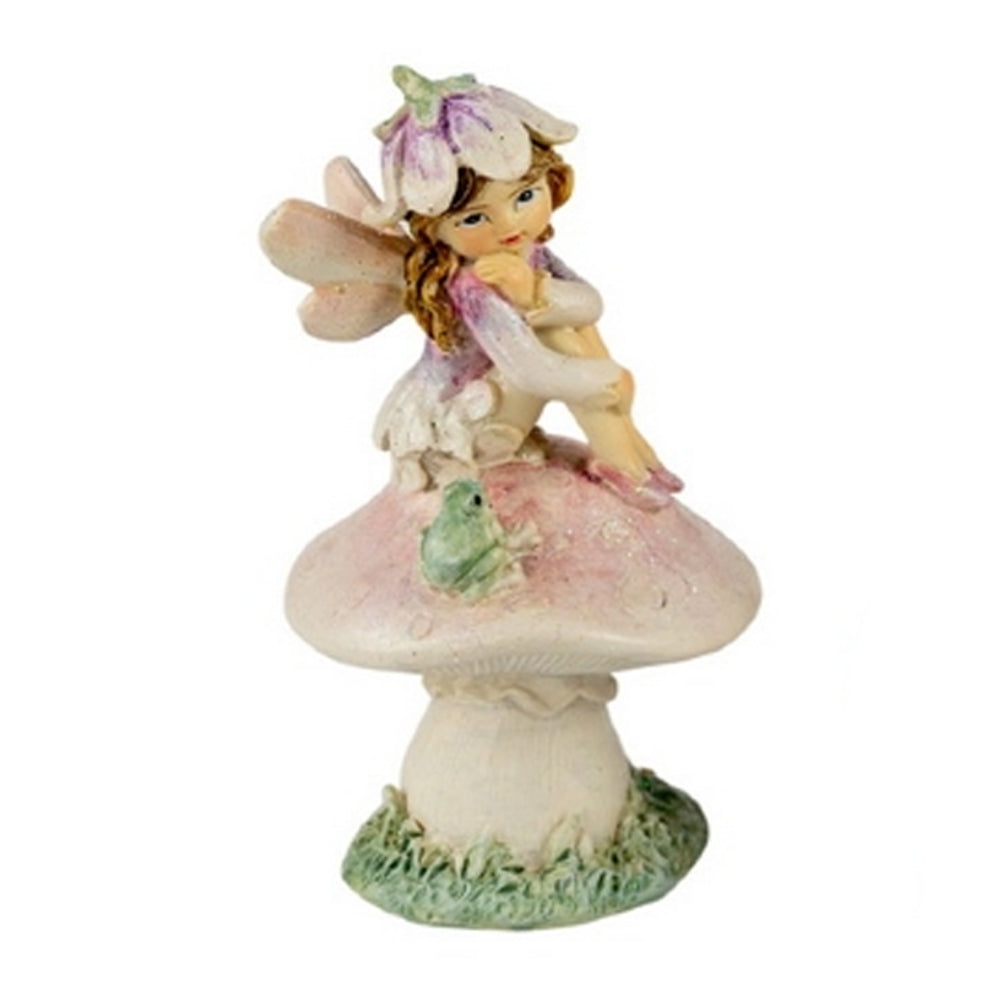 Close up view of Flower Garden Fairy Sitting on Mushroom with Frog