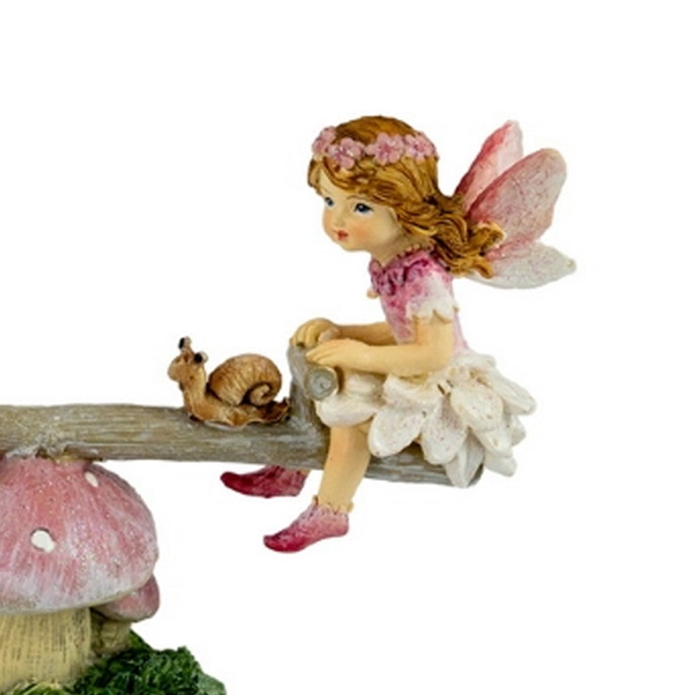 Close up view of Flower Garden Fairies on a See Saw - miniature fairy garden figurine