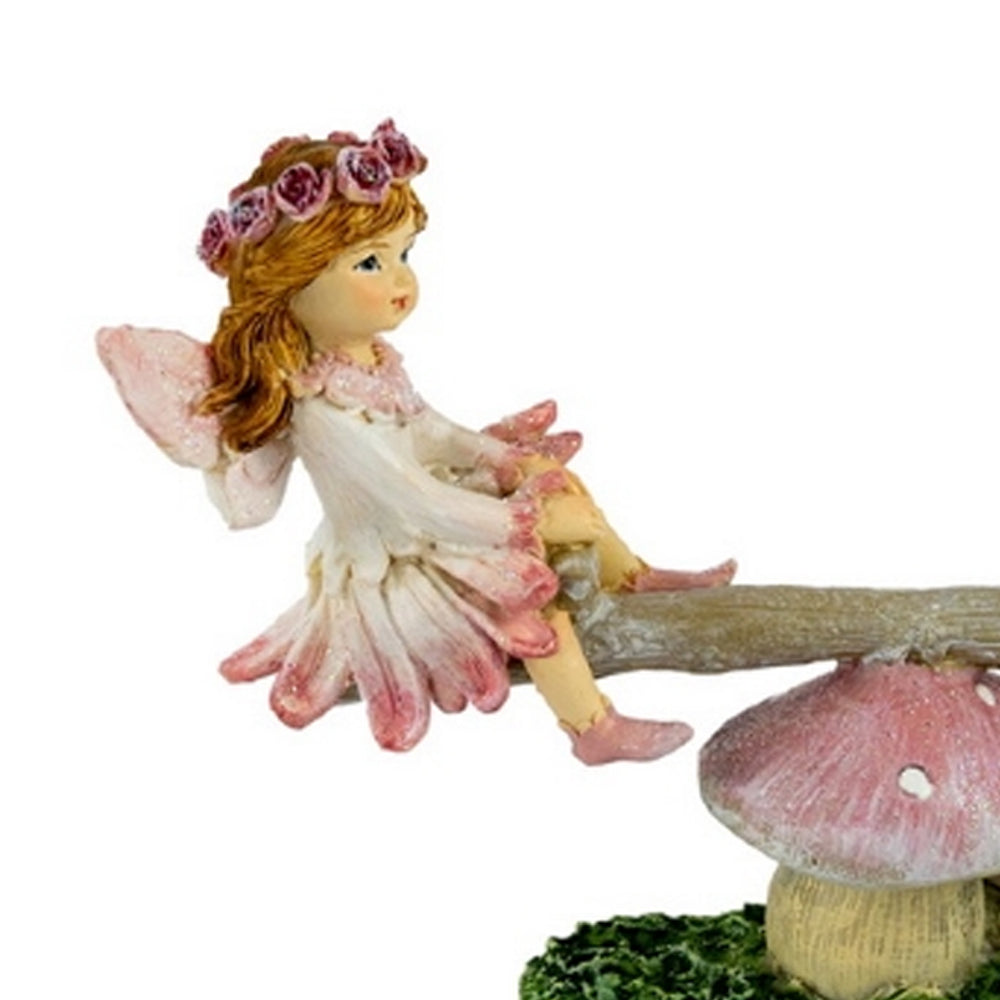 Close up view of Flower Garden Fairies on a See Saw - miniature fairy garden figurine