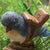 Miniature Flying Lessons - Bird with Saddle Figurine, blue bird with brown saddle and sign