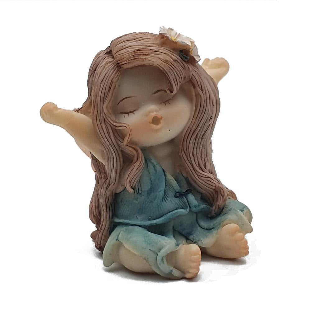 Little Fairy Yawning, small fairy with a blue/green dress, arms outstrecthed, eyes closed, and yawning.