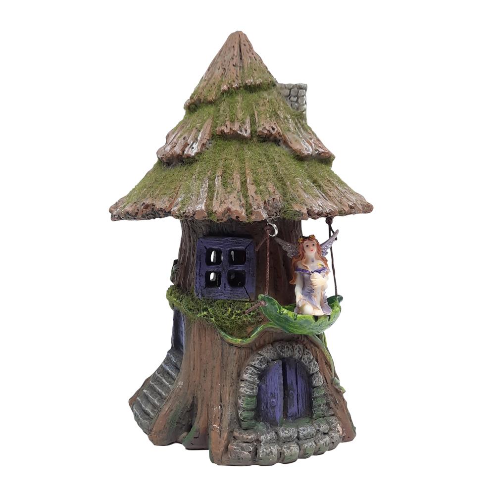 Moss Tree House with Hammock - Solar, a miniature fairy house for the garden with mossy wooden roof and purple arched door, and a small hammock hanging to the side
