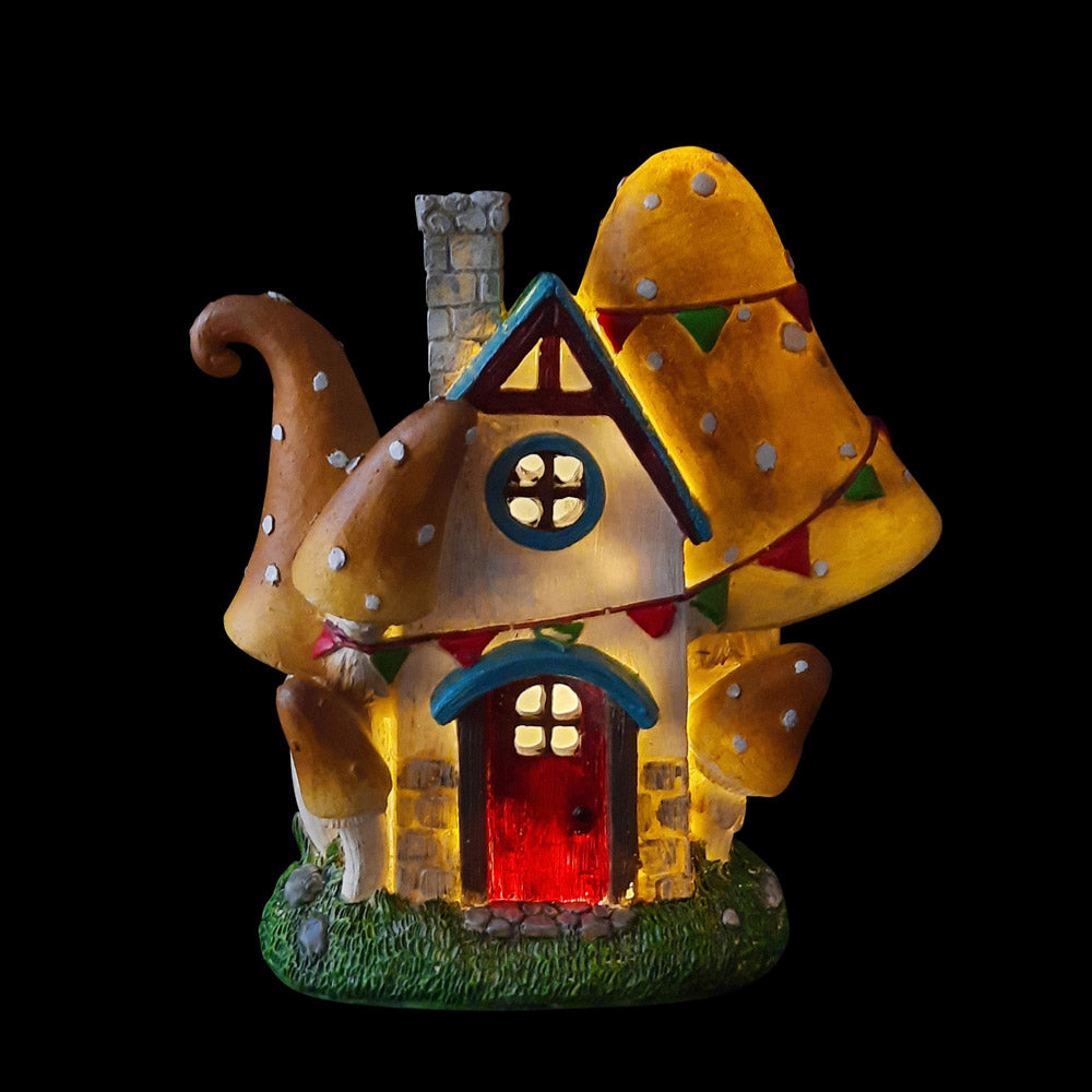 Mushroom Cottage - night view of miniature fairy house for the garden