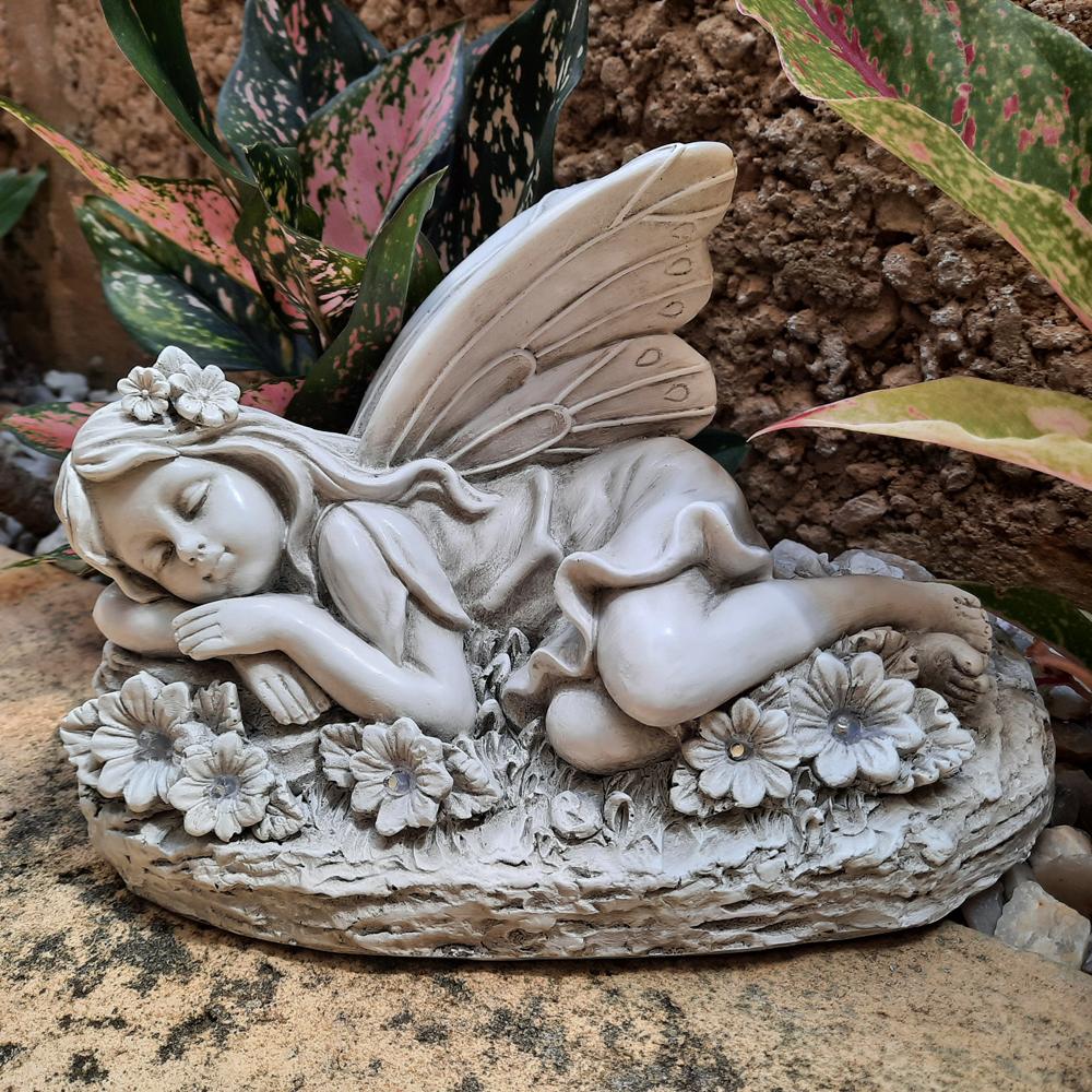 Sleeping Garden Fairy - Solar, a statuette for the garden depicting a sleeping fairy on a grassy mound