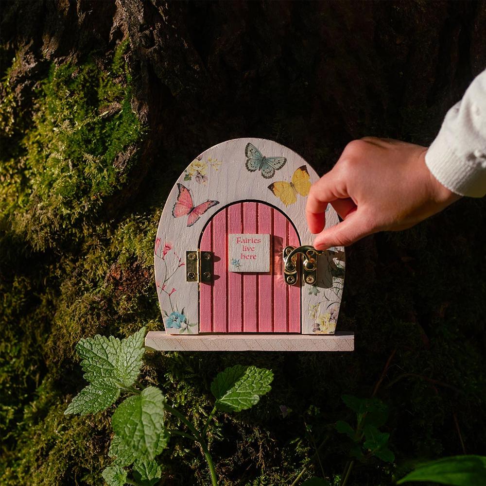 Truly Fairy Wooden Fairy Door, Fairy Themed Party Decoration, displayed against a tree trunk in the forest