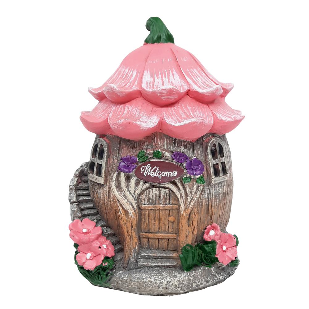 Welcome Fairy Flower House, a miniature fairy house for the garden, with tree trunk style base and pink flower roof and winding staircase to the side displayed on a blank background
