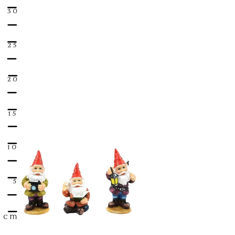 set of 3 miniature gnomes, gnome photographer, gnome librarian and gnome miner, all posed with tools of their trade